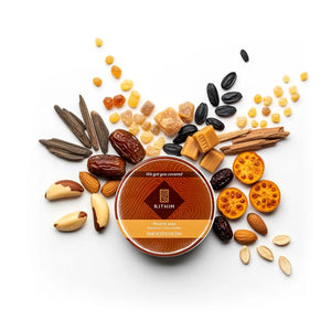 Rithim smooth oudh beard wax container surrounded by various nuts and fruits, agarwood, prickly pear, desert date on a white background